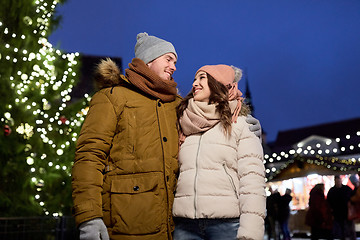 Image showing happy couple talking at christmas tree