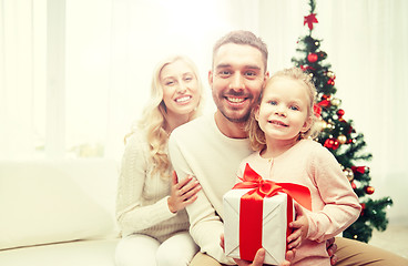 Image showing happy family at home with christmas gift box