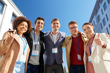 Image showing business team with conference badges in city