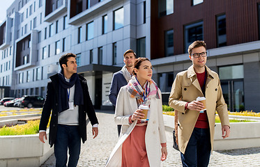 Image showing people with coffee and conference badges in city