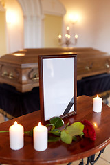 Image showing photo frame and coffin at funeral in church