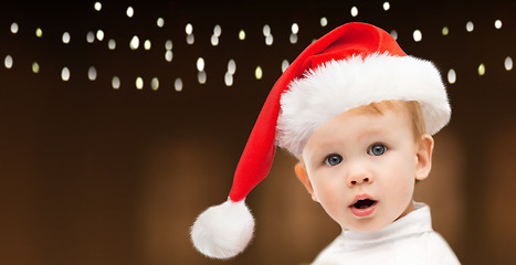 Image showing little baby boy in santa hat at christmas