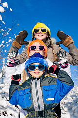 Image showing Happy little children playing  in winter snow day.