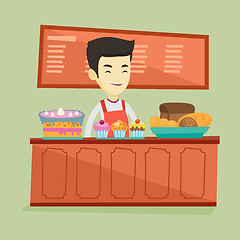 Image showing Worker standing behind the counter at the bakery.