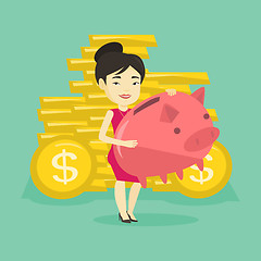 Image showing Business woman holding big piggy bank.