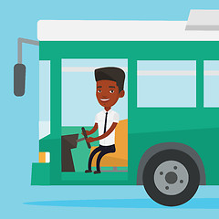 Image showing African bus driver sitting at steering wheel.