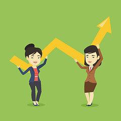 Image showing Two business women holding growth graph.