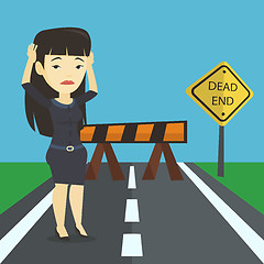 Image showing Business woman looking at road sign dead end.