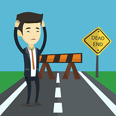 Image showing Business man looking at road sign dead end.