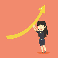 Image showing Business woman holding arrow going up.