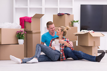 Image showing young couple moving  in new house