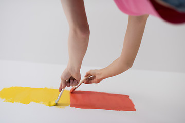 Image showing couple painting interior wall