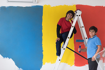 Image showing boys painting wall