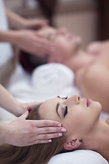 Image showing couple enjoying head massage at the spa