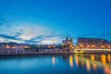 Image showing Notre Dame Cathedral with Paris cityscape at dus