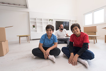 Image showing portrait of happy young boys with their dad