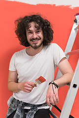 Image showing man with funny hair over color background with brush