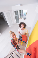 Image showing couple painting interior wall