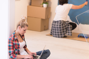 Image showing Happy couple doing home renovations