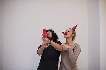 Image showing romantic young  couple celebrating  party with confetti