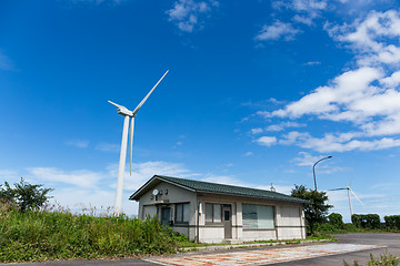 Image showing Wind turbines with blue sky