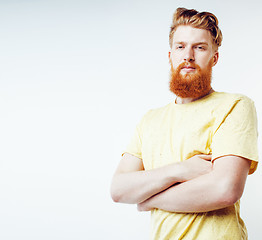 Image showing young handsome hipster ginger bearded guy looking brutal isolate