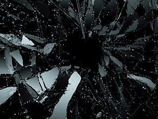 Image showing Pieces of destructed Shattered glass on black 