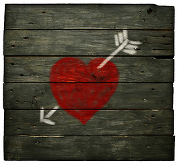 Image showing painted heart with arrow on old wooden planks