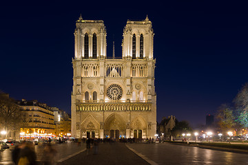 Image showing Notre Dame Cathedral with Paris cityscape at dusk