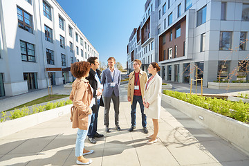 Image showing business team with conference badges in city