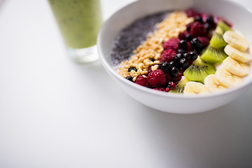 Image showing smoothie and bowl of yogurt with fruits and seeds