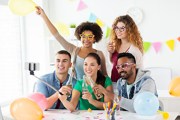 Image showing happy team taking selfie at office party