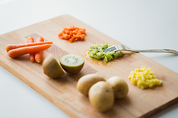 Image showing mashed fruits and vegetables with forks on board