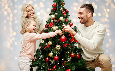 Image showing happy family decorating christmas tree