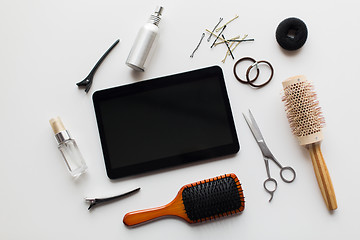 Image showing tablet pc, scissors, brushes and other hair tools