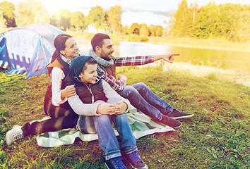 Image showing happy family with tent at camp site