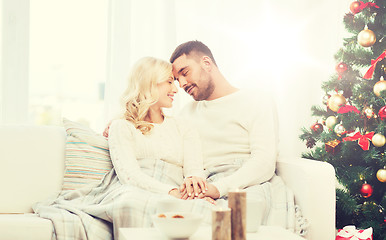 Image showing happy couple at home with christmas tree