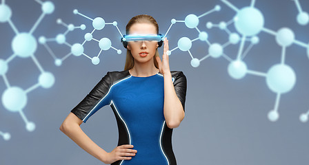 Image showing woman in virtual reality 3d glasses with molecules