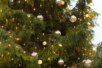 Image showing close up of fir with christmas tree toys outdoors