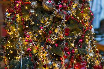 Image showing close up of fir with christmas tree toys outdoors