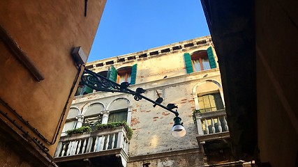 Image showing Typical scene of Venice, Italy, with old houses and pigeons