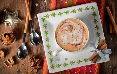 Image showing Cup of coffee and Christmas decorations 