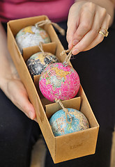 Image showing Christmas balls shaped as globe in box