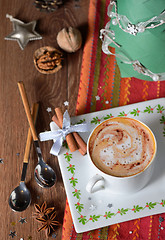 Image showing Cup of coffee and Christmas decorations