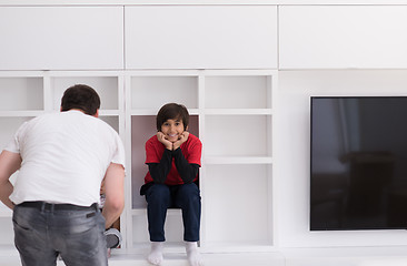 Image showing young boys posing on a shelf