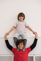 Image showing young boys posing line up piggyback