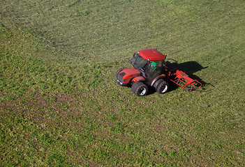 Image showing Small tractor in a field