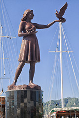 Image showing MARMARIS, TURKEY - OCTOBER 19, 2013: Girl with a pigeon starue