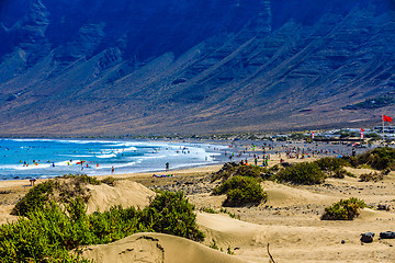 Image showing Surfers beach Famara on Lanzarote always has a red flag.