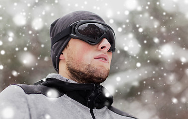 Image showing sports man with ski goggles in winter outdoors